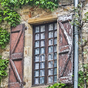 France, Cordes-sur-Ciel. Weathered shutters and window