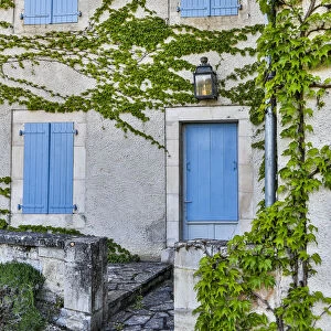France, Lot River Valley. Home with blue shutters