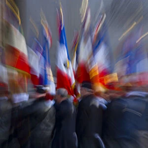 France, Paris. Military ceremony with flags at the Arc de Triomphe