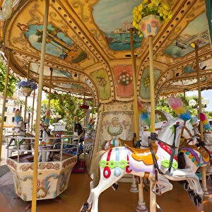France, Provence, Cannes. Colorful and ornate outdoor carousel. Credit as: Fred Lord