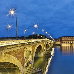 France, Toulouse. View of Pont Neuf and the Garonne River at sunset