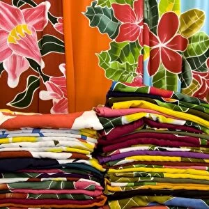 French Polynesia, Cook Islands, Rarotonga. Display of colorful tropical fabrics