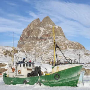 The frozen harbor of Uummannaq during winter in northern West Greenland beyond the Arctic Circle. Greenland, Danish territory The frozen harbor of Uummannaq during winter in northern West Greenland beyond the Arctic Circle. Greenland, Danish territory