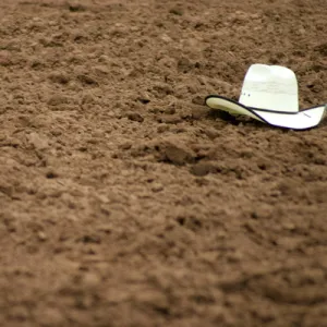 Galisteo, New Mexico, United States. Rodeo hat left in dirt at Galisteo Rodeo