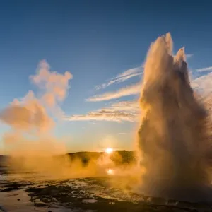 The geysir Strokkur in the geothermal area Haukadalur part of the touristic route