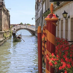 Gondola in narrow Canal. Venice. Italy