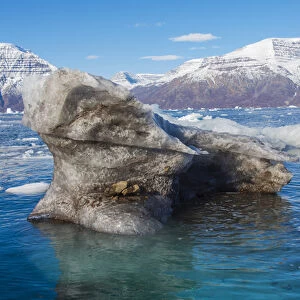 Greenland. Scoresby Sund. Gasefjord. Krogen. Dirty iceberg from the bottom of a glacier