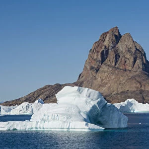 Greenland. Uummannaq. Uummannaq mountain and iceberg