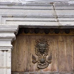 Guatemala, Antigua. Ornate detail on wooden door and trim on a colonial home in Antigua