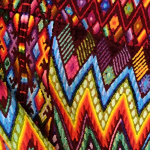 Guatemala, Chichicastenango, Painterly effect close-up of colorful fabric. Credit as