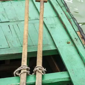 Ha Long Bay, Vietnam (UNESCO World Heritage Site). Close-up of oars on a green boat