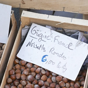 Hazelnut nuts for sale at a market stall at the market in Bergerac for 6 euro per kilo