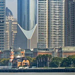 High-rise and light house by Huangpu River in Pudong, Shanghai, China