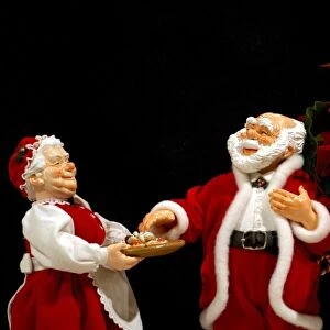 Holiday still life. Simpich Caracter Doll, Mr. & Mrs. Claus with cookie tray. Property released