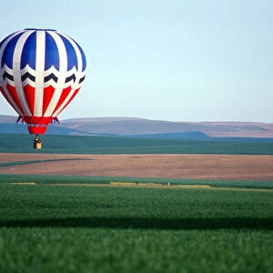 Hot air balloon; wheat fields; Walla Walla, Washington; red, white, and blue; flight