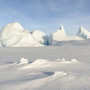 Iceberg frozen into the sea ice of the Melville Bay, near Kullorsuaq in the far north of Iceberg frozen into the sea ice of the Melville Bay, near Kullorsuaq in the far north of