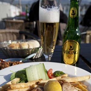 ICELAND20739_JUL2009_BARTRUFF. CR2-Fish and chips Icelandic style is served at a rooftop