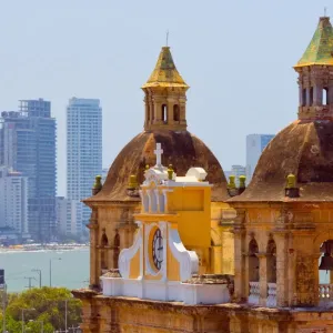 Iglesia de San Pedro Claver in the old town, high-rises of the new city in the background Iglesia de San Pedro Claver in the old town, high-rises of the new city in the background