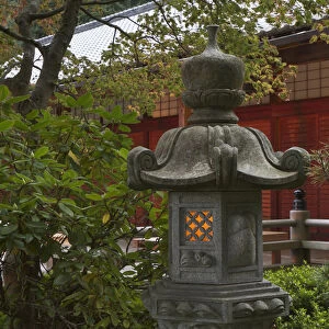 Illuminated stone lantern and pavillion in Portland Japanese Garden, Oregon