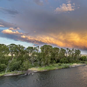 Incredible stormy light on the Madison River at sunset near Ennis, Montana, USA