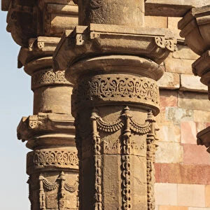 India, Delhi. Carved stone columns at Qutub Minar
