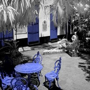 Infra red image with blue chairs in Guanabacoa area of Havana Cuba of the Santeria