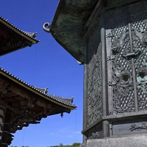 An intricate metal lantern at the entrance to Daimonji Temple, home to the giant