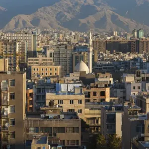 Iran, Tehran, elevated city view with mosque, dawn
