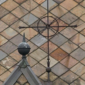 Iron cross on slate roof Laggen River river valley, Ringebu norway