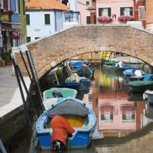 Island of Burano, Burano, Italy. Colorful Burano City homes Reflecting in the Canal