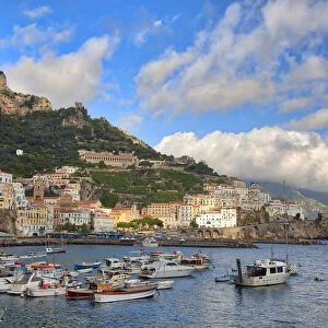 Italy, Amalfi. Boats in the harbor and coastal town of Amalfi