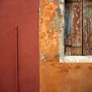 Italy, Burano. Weathered house window and wall