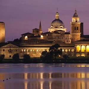 Italy, Mantua Province, Mantua. Town view and Palazzo Ducale from Lago Inferiore, dusk
