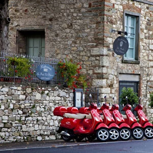 Italy, Radda in Chianti. Vespa scooters for rent in the town of Radda in Chianti