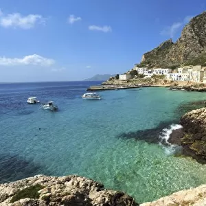 Italy, Sicily, Egadi Islands, Levanzo, transparent blue sea in front of little village