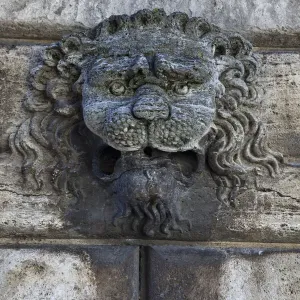 Italy, Tuscany, Montepulciano. Carving of a lions head on a stone building Italy, Tuscany, Montepulciano. Carving of a lions head on a stone building