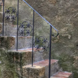Italy, Tuscany, Pienza. Steps with wrought iron railing leading to the entrance to a home in Pienza Italy, Tuscany, Pienza. Steps with wrought iron railing leading to the entrance to a home in Pienza