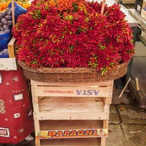 Italy, Venice. Colorful spicy peppers (pepperoncini) on display and for sale in the Rialto Market