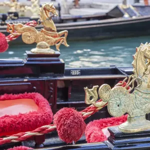 Italy, Venice. Detail of a very ornate gondola boat