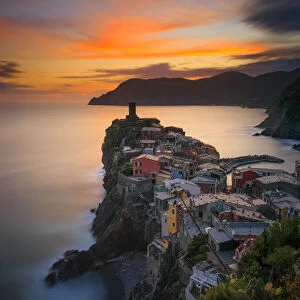 Italy, Vernazza. Overview of coastal town at sunset
