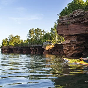 Kayaker exploring the sea caves of Devils Island in the Apostle Islands National Lakeshore