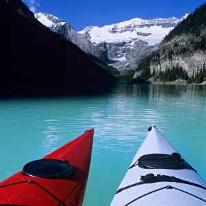 Kayaks on Lake Louise below Mount Victoria in the Canadian Rockies; Banff National Park; Alberta
