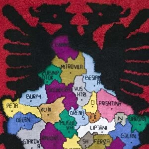 KOSOVO, Pec. Roadside Souvenir stall selling rug with Albanian Map. Kosovo is primarily