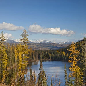 Lake Marshall in autumn in the Mission Mountains with the snow capped Swan Range