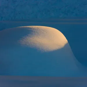 Landscape of snow mound at sunset, Haines, Alaska, USA Landscape of snow mound at sunset, Haines, Alaska, USA