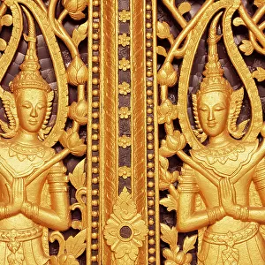 Laos, Luang Prabang. Golden relief carvings