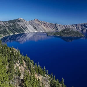Looking down on blue waters of Crater Lake in Crater Lake National Park, Oregon, USA