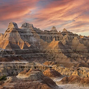 Magnificent set of striated hoodoos set against the backdrop of sunset colors in the sky