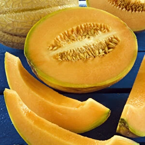 Whole melon and one cut into pieces (Cucumis melo)