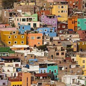 Mexico, Guanajuato. Colorful homes rise up the hillside of this colorful Mexican town